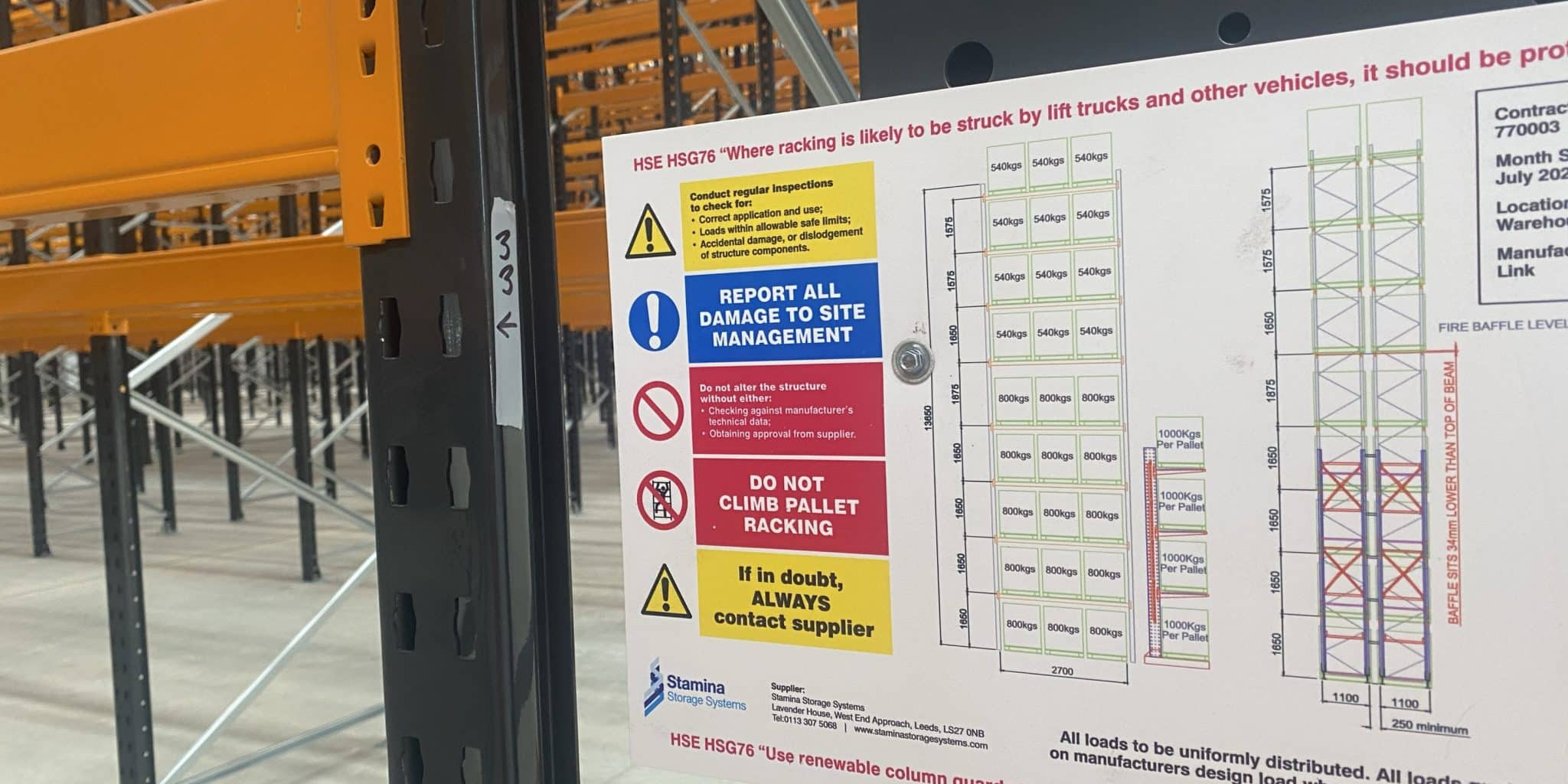 A load notice fixed to an installled pallet racking system, to show weight capacities.