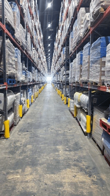 Stocked pallet racks in transport warehouse