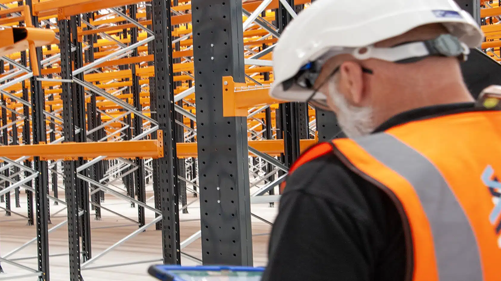 team member inspecting racking