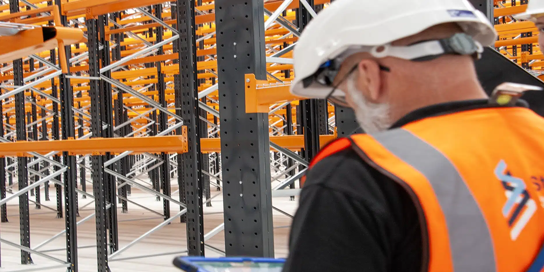 team member inspecting racking