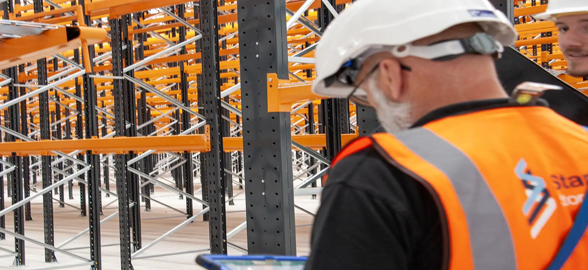 team member inspecting racking