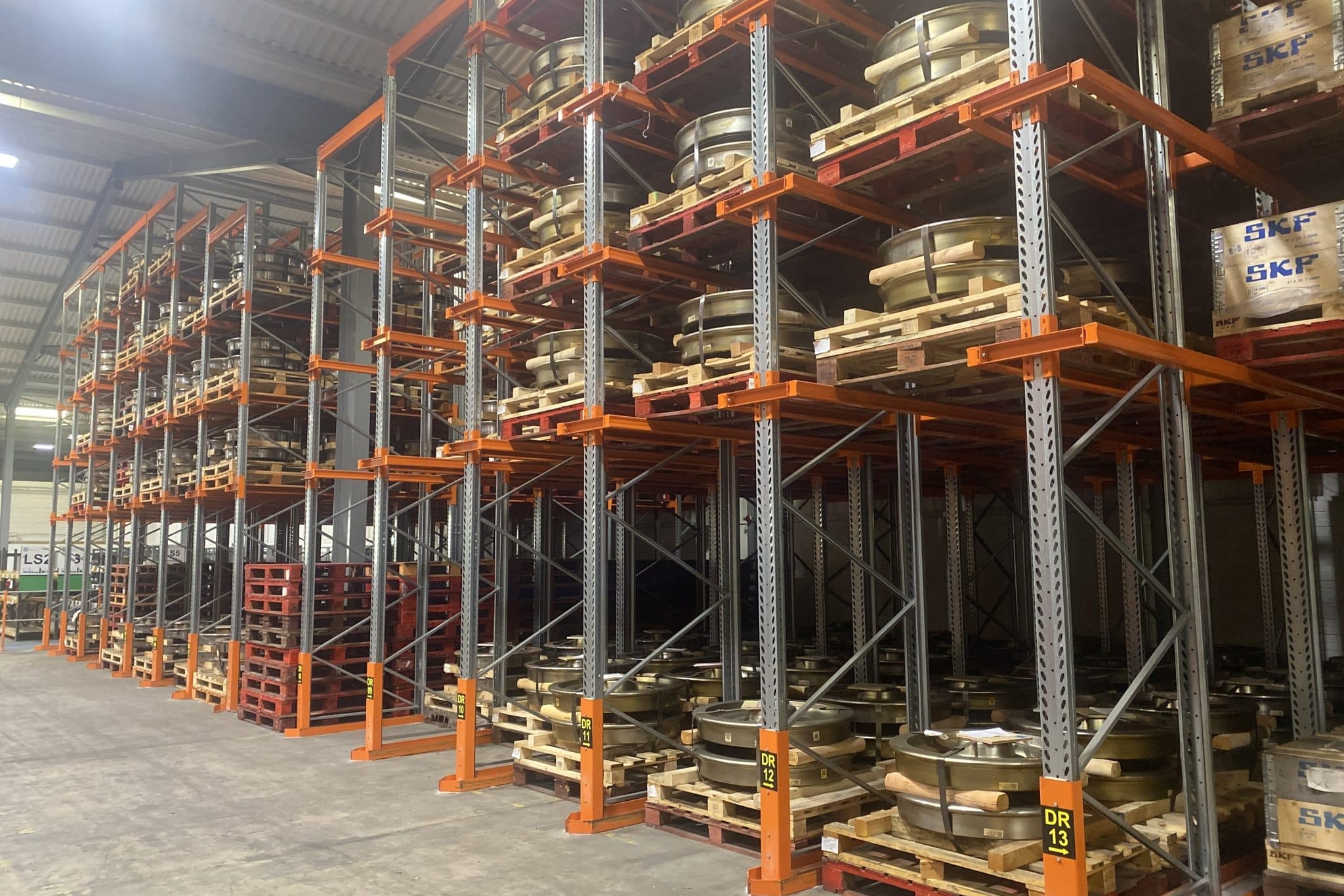 pallet racking being used to store tyres and car parts in warehouse